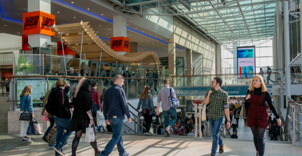 Shoppers in front of Yo Sushi at Drake Circus Shopping Centre in Plymouth 